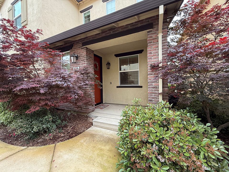 Welcome home to this beautifully landscaped front yard with a charming porch