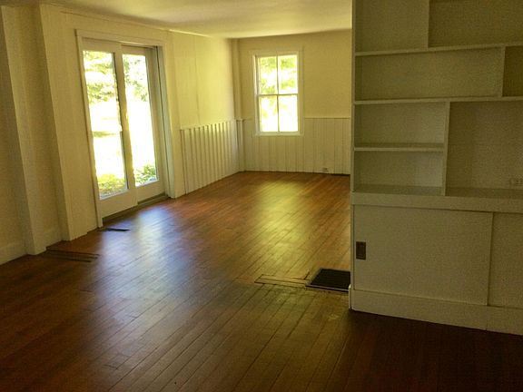 Looking from living room near front door into dining room.