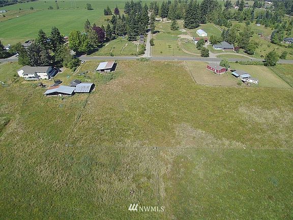 Almost 20 Acres fully fenced and cross fenced with income generating houses and 3 barns, chicken coop and tool shed with power.  Year round creek runs through property.  Has been a cattle/pig farm in the past.>