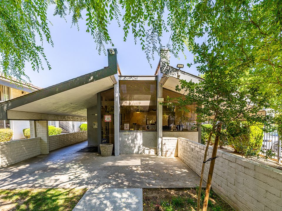 Inviting community entrance with modern architecture.