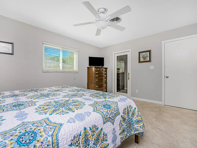 Primary bedroom with walkthru closet access to bathroom
