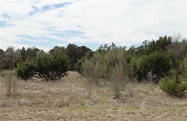 Heavily treed with cedars and native hardwoods