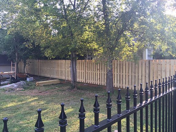 Fenced in back yard with nice patio area
