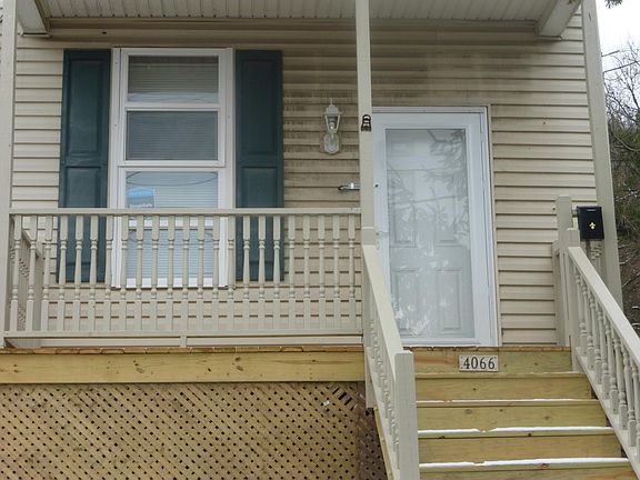Covered porch, new windows, door and secure storm door