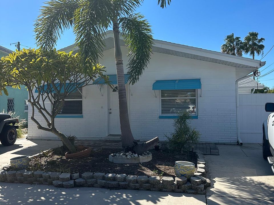 Unit B is to the right of the building to the rear.