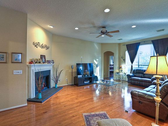 GLEAMING polished wood floors flow thru-out the main living areas of this beautifully home, with 9 f