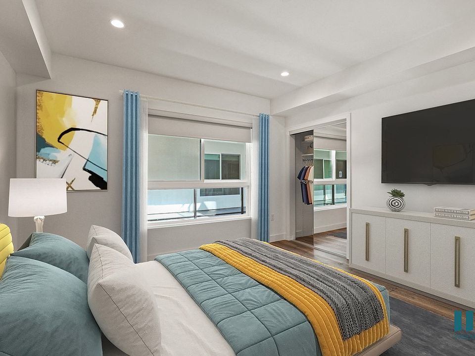 Spacious Bedroom with Mirrored Closet and Vinyl Flooring
