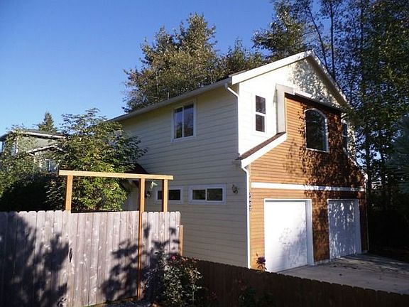 Back of the house with a walk out to the deck area.
