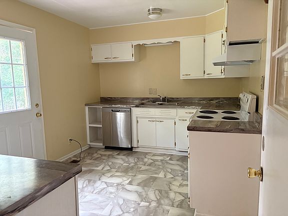 This loaded kitchen is remodeled with new counter top, flooring, and more