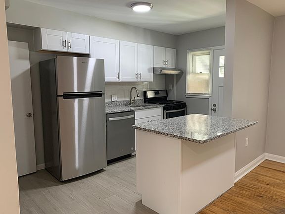 Kitchen with new appliances and granite counter tops.