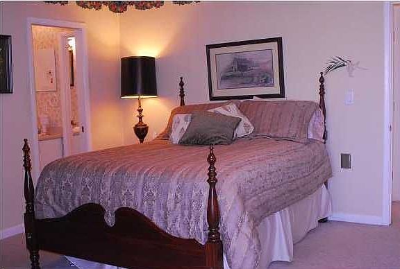 The master bedroom is spacious and has a private balcony too!