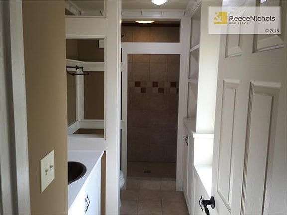 Master Bathroom with Tile Shower and Floor