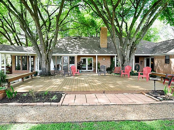 THE DECK AREA LOOKING BACK TOWARDS THE HOME AND THE SUNROOM