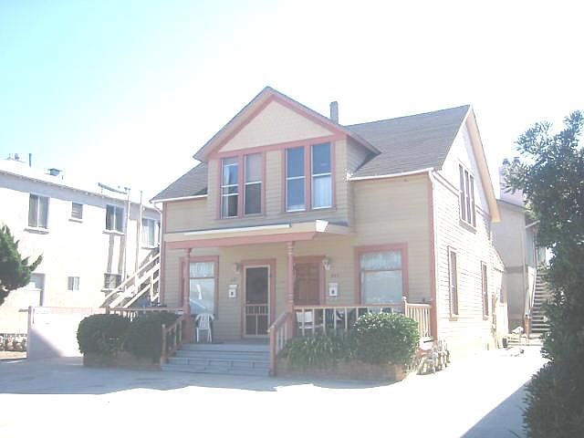 Front of property with parking area to the right