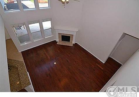 Family with tall ceilings & wall of windows