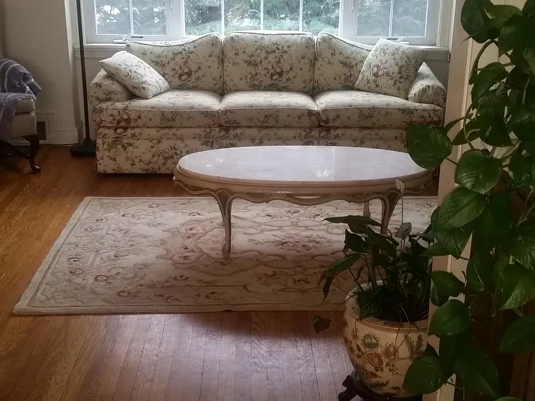 Sunny living room with evergreen curtains