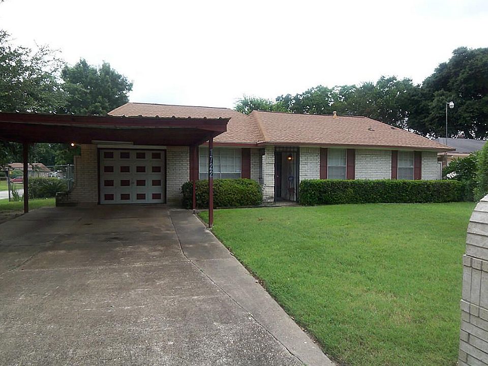 HOME IS ON CORNER LOT WITH CARPORT