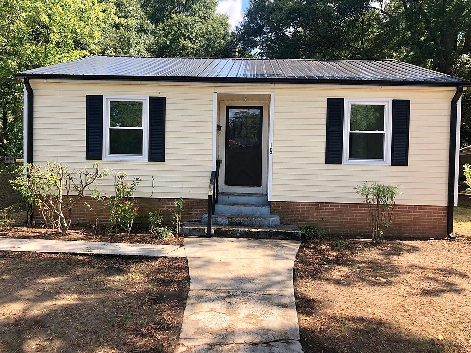 Outside of the home has a new roof, gutters, and windows.