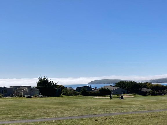 Views from second story primary bedroom (Captain's Quarters) and en suite bathroom of golfers on 14th fairway and water views of Doran Beach, Bodega Head and the Pacific Ocean and coastal marine layer beyond.