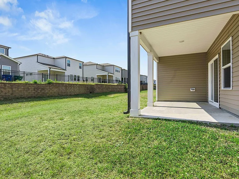 Large backyard and a covered patio perfect for grilling !