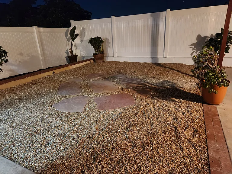 Huge side patio and new fence.