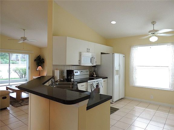 Kitchen opens to living room