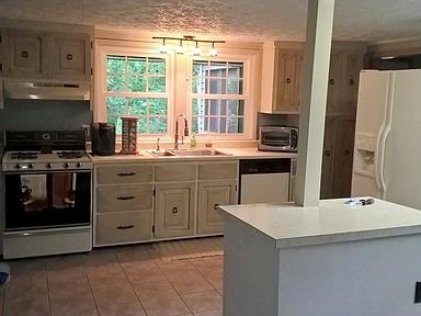 Kitchen with tile floor and center island
