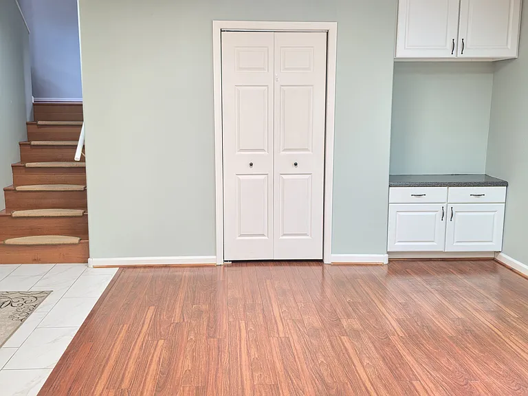 downstairs utility room with half bath, entered from the garage