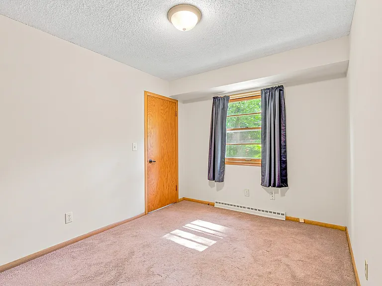 Bedroom #3 - third bedroom with hallway and rear-entry access