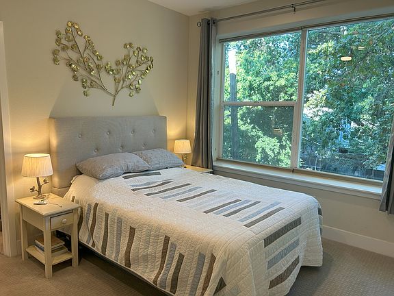 Primary bedroom on 3rd floor. Two of the three bedrooms have en-suite bathrooms.