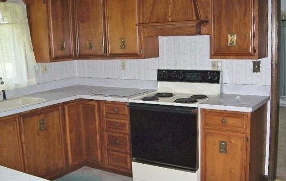 Pecan cabinets with matching stove hood