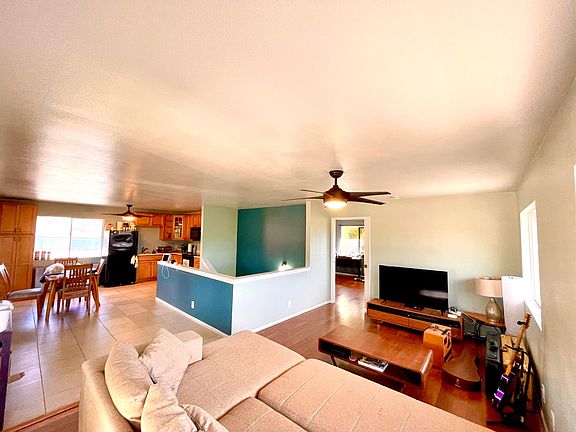 Living room into kitchen. All furniture can remain.