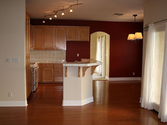 large kitchen with island, plenty of cabinets, nook