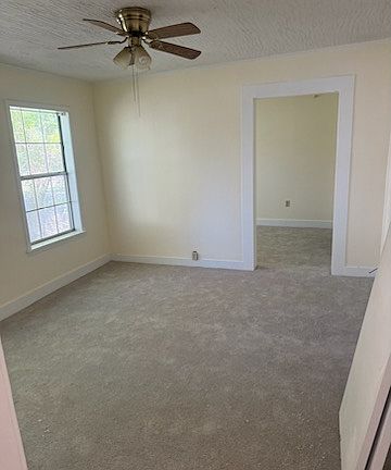Large master with new carpet, ceiling fan. Adjacent room can be used as nursery or office.