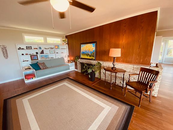 Notice the built in cubbies above the built in sofa. So comfy! Wood burning fireplace