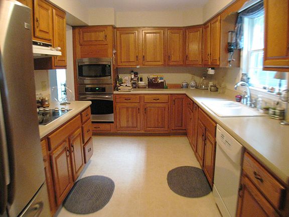 kitchen with stainless refrigerator, oven and microwave
