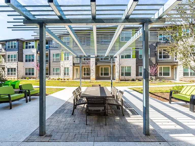 Outdoor gazebo with dinning table-style seating