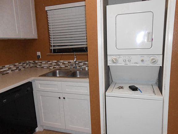 Kitchen w/stacked washer dryer combo