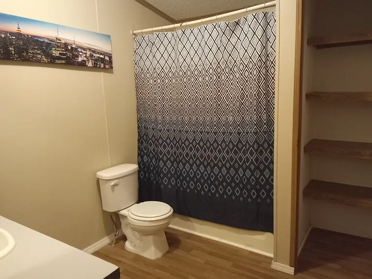 Second restroom away from the primary room .