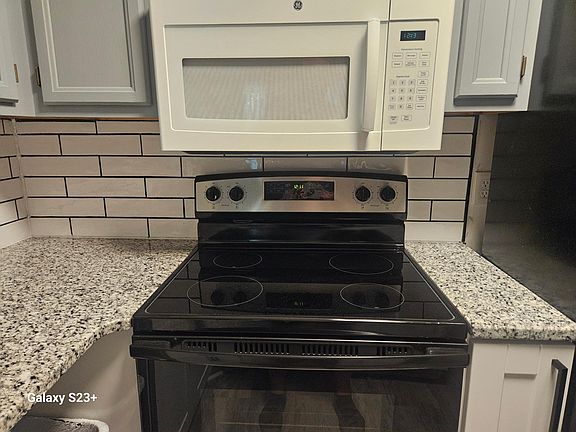 Counter, stove, backsplash