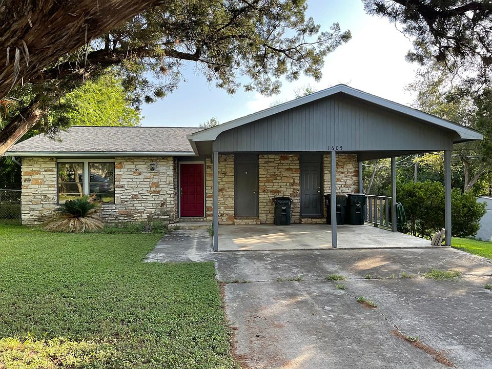 Front yard (left door to living room, right door to kitchen, middle door is an external closet for yard tools etc.)