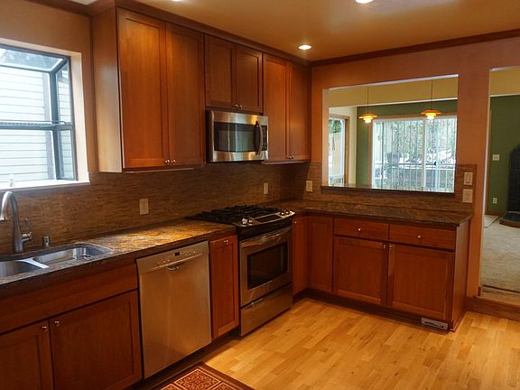 Kitchen with granite countertops and stainless steel appliances