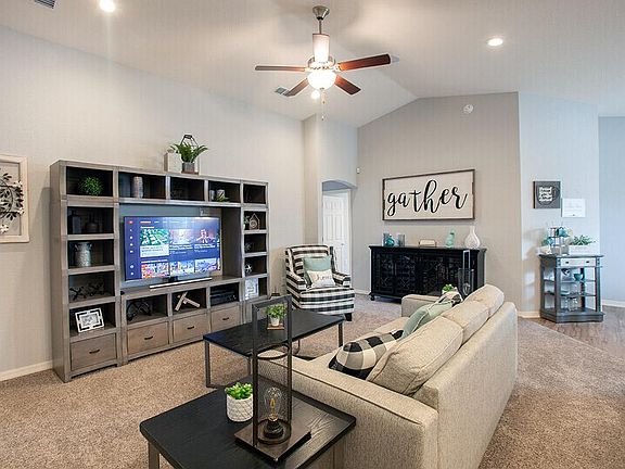 Spacious and welcoming gathering room - New home for sale in Lake Alfred, FL. Photo showcases the ho