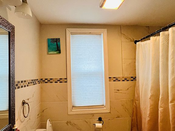 Main level bathroom with bathtub