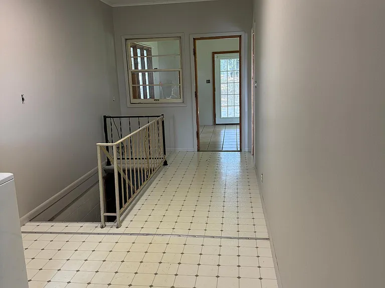 Breezeway includes washer dryer hook-ups, staircase to unfinished basement, and entrance into the bonus room!
