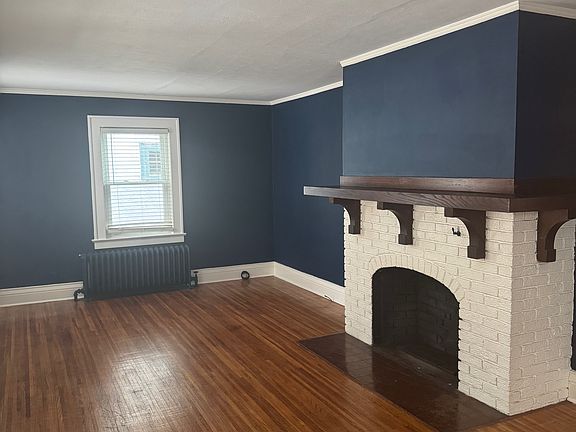 large living room with decorative fireplace