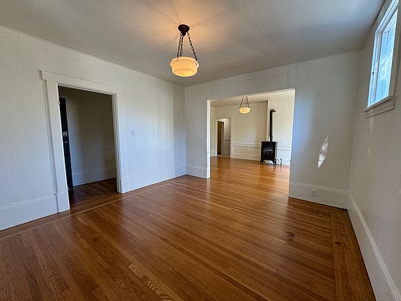 living room in the foreground, dining room in the background. Original light fixtures