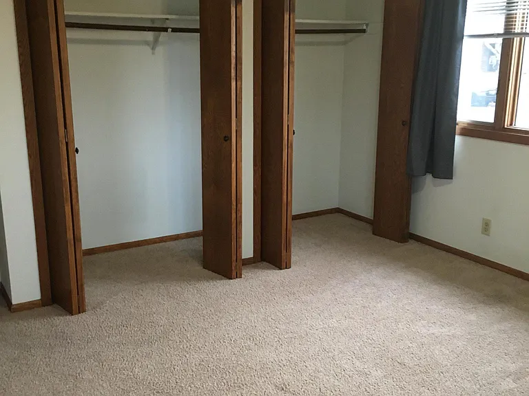 Closets in larger bedroom