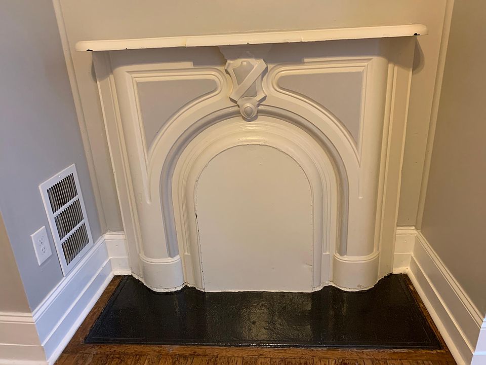 Original 1880 fireplace in bedroom
