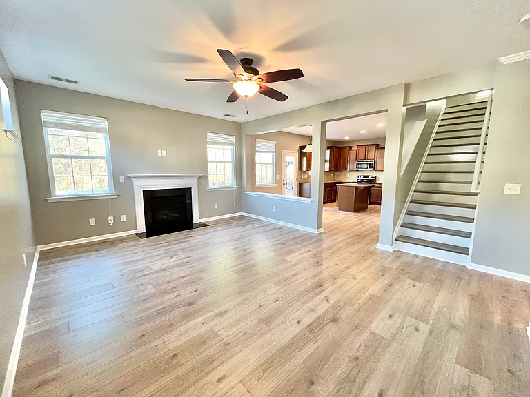 Family room with open floor plan looking into kitchen